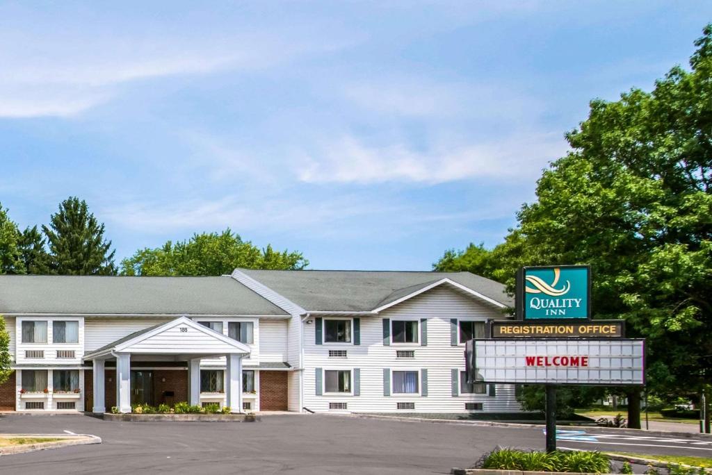 a front view of a hotel with a sign at Quality Inn Cortland - University Area in Cortland