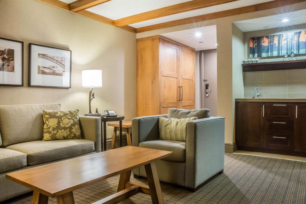 a living room with a couch and a table at Comfort Inn The Pointe in Niagara Falls