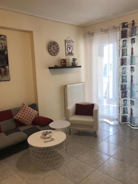A seating area at Cozy studio apartment in PIREUS