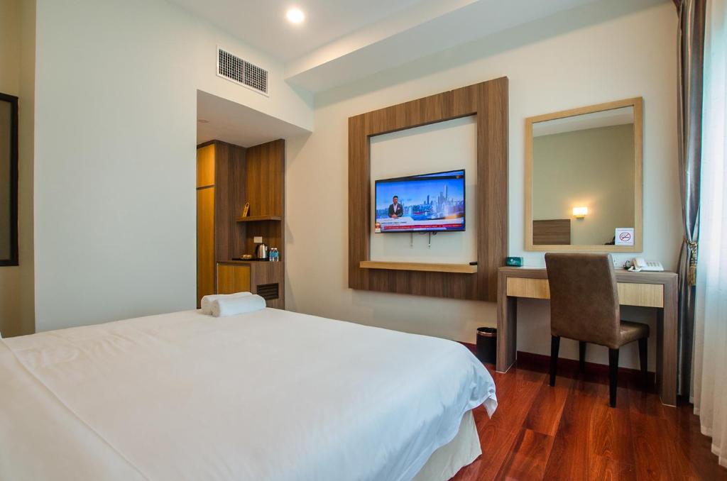 TV a/nebo společenská místnost v ubytování Grand Wonderful Hotel