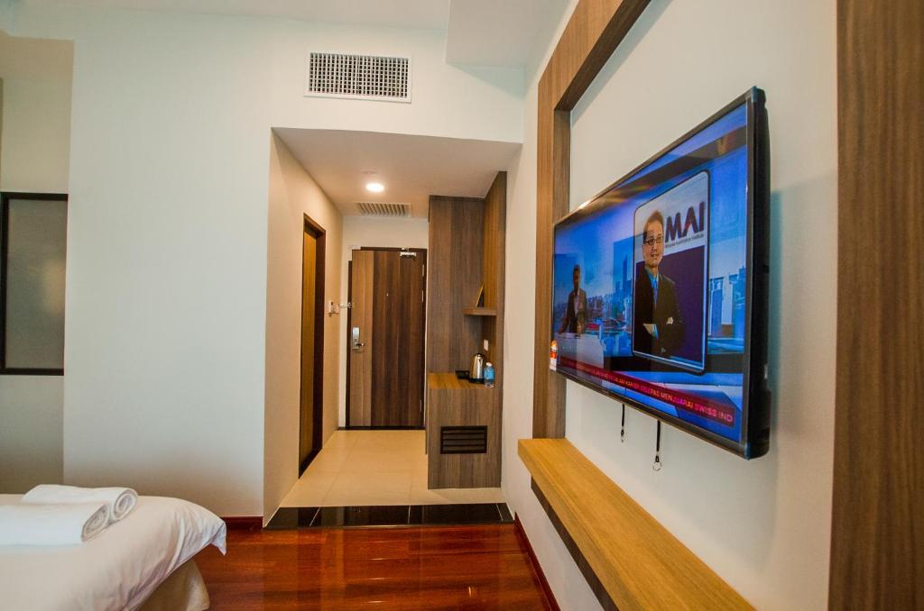 TV a/nebo společenská místnost v ubytování Grand Wonderful Hotel