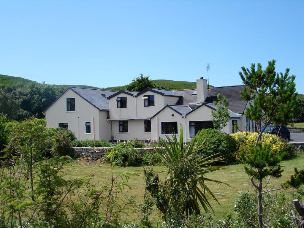 a house with a garden in front of it at Ben Breen House B&B in Clifden