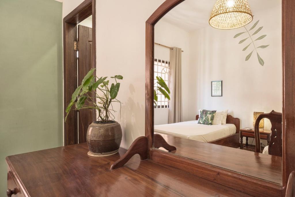 Postel nebo postele na pokoji v ubytování Babel Siem Reap Guesthouse