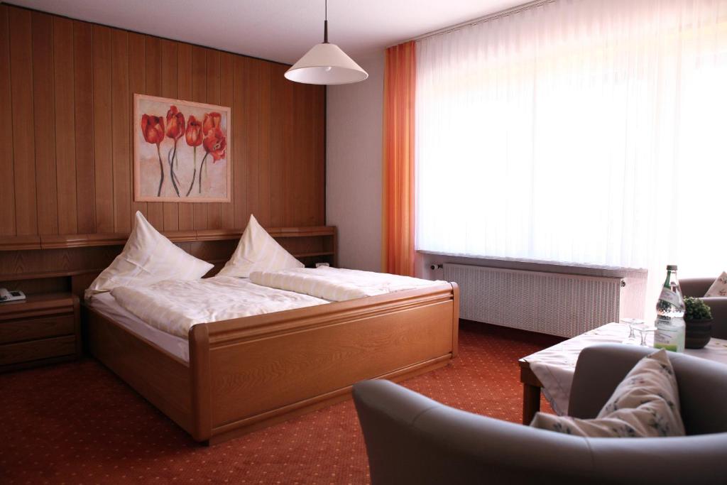 Postel nebo postele na pokoji v ubytování Hotel Ursula Garni