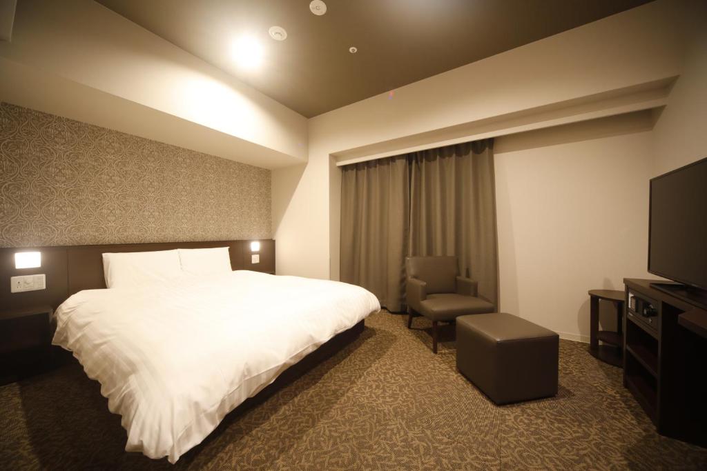 TV a/nebo společenská místnost v ubytování Dormy Inn Premium Osaka Kitahama