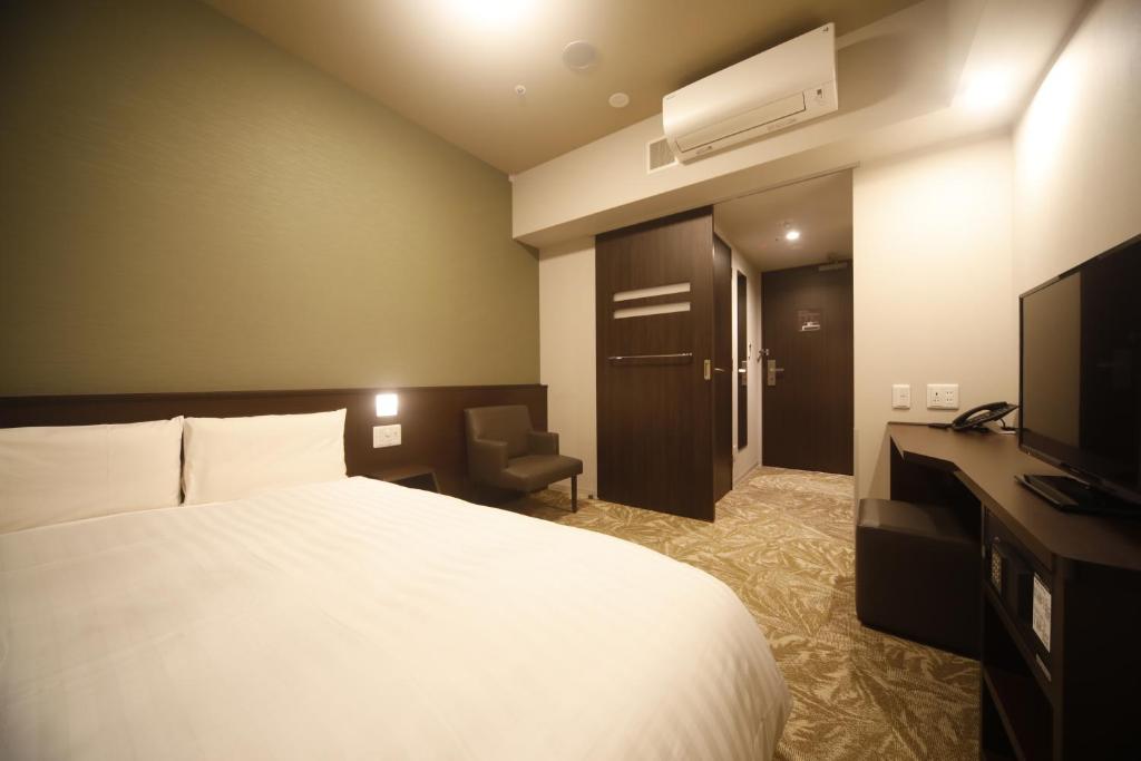 TV a/nebo společenská místnost v ubytování Dormy Inn Premium Osaka Kitahama