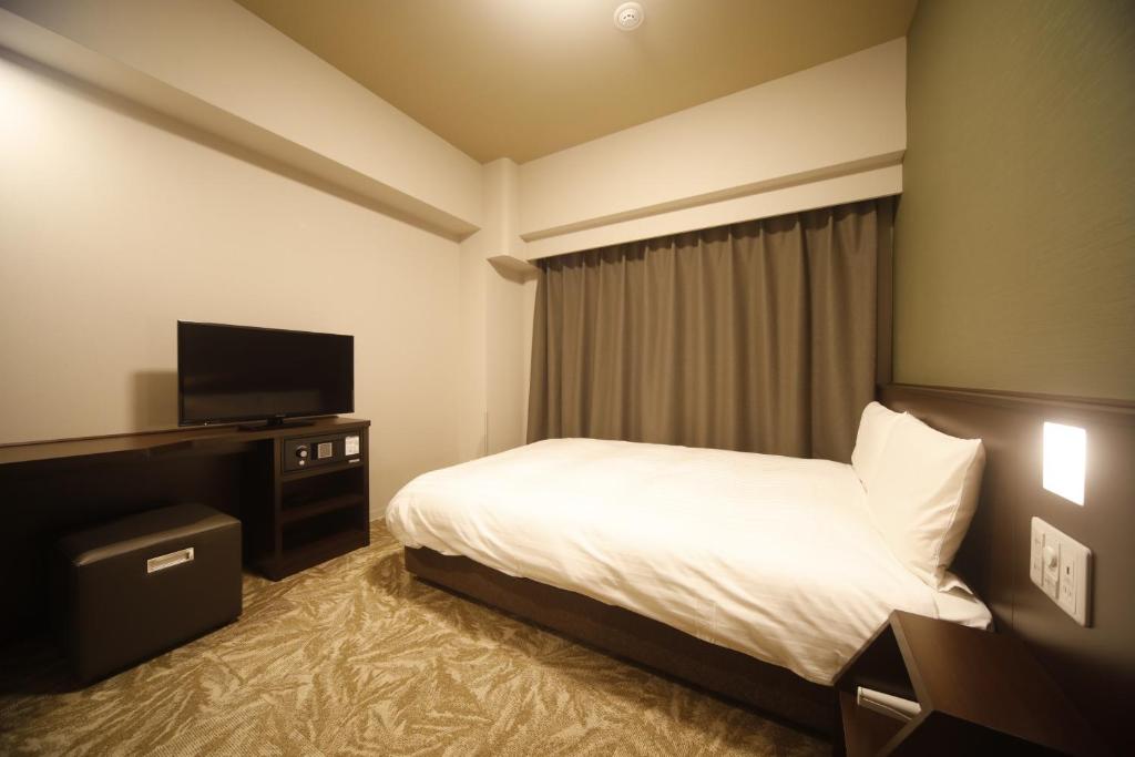 TV a/nebo společenská místnost v ubytování Dormy Inn Premium Osaka Kitahama