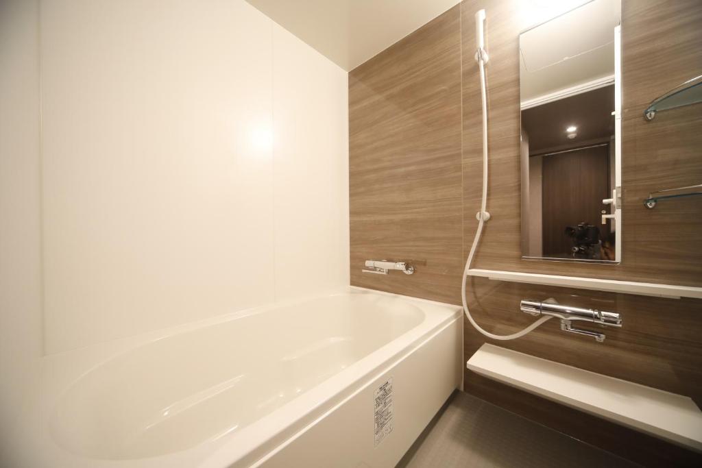 Koupelna v ubytování Dormy Inn Premium Osaka Kitahama