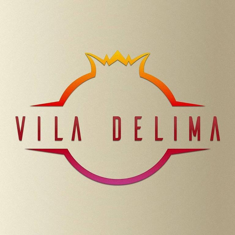 a sign that says villa delma with a crown on it at Vila Delima in Lamongan