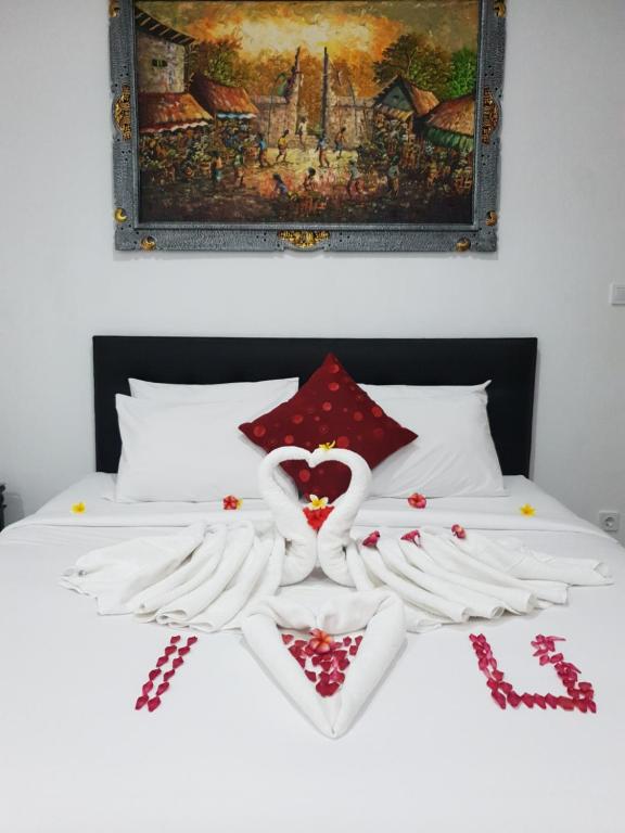 Postel nebo postele na pokoji v ubytování Palm Bamboo Hotel