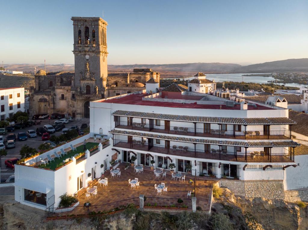 an aerial view of a building with a clock tower at Parador de Arcos de la Frontera in Arcos de la Frontera