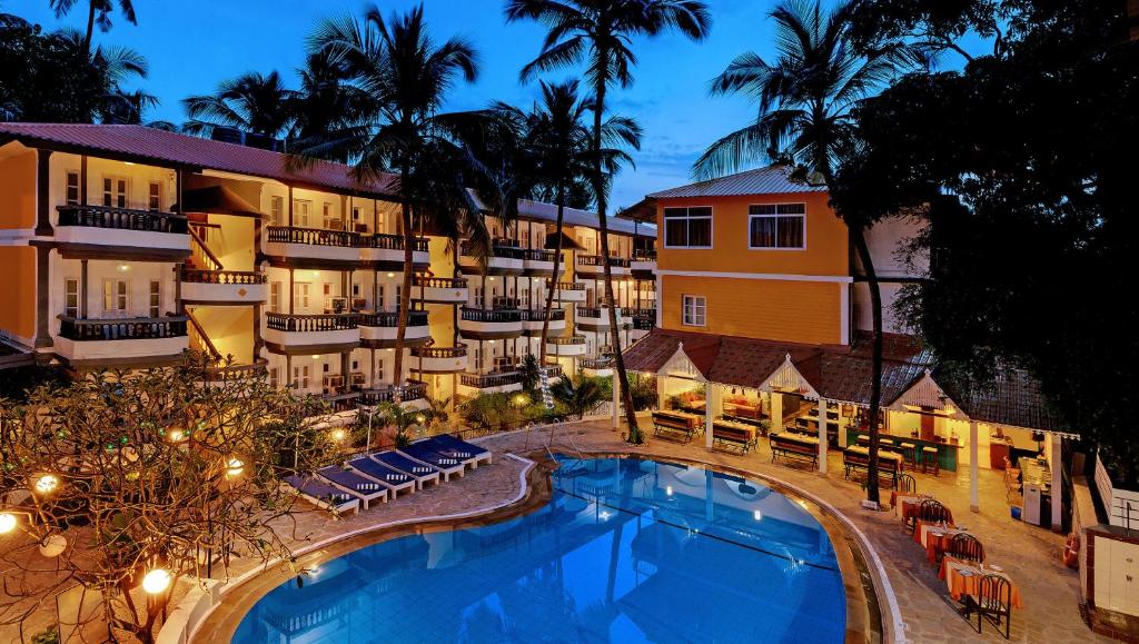 an aerial view of a hotel with a swimming pool at Santiago Beach Resort in Baga