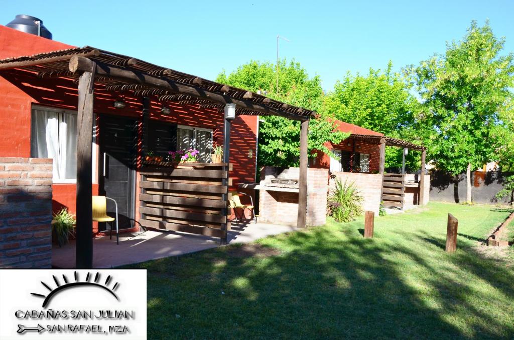 a pergola on the side of a house at San Julián in San Rafael