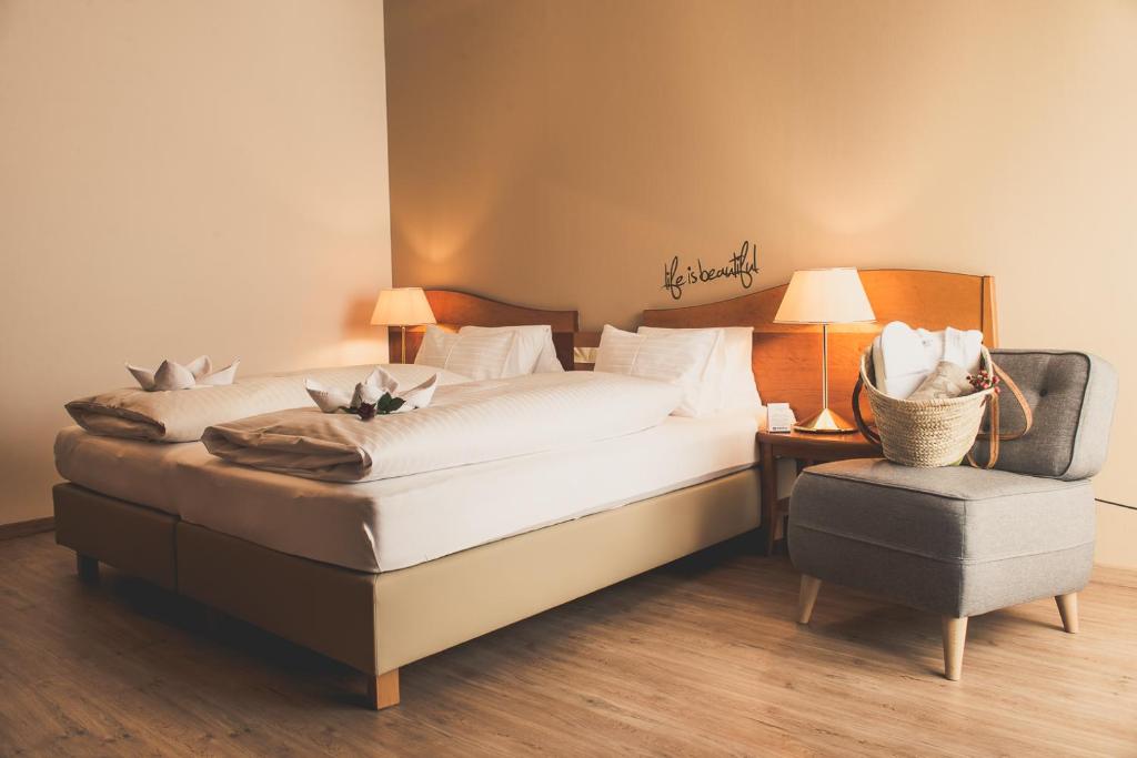 Postel nebo postele na pokoji v ubytování Hotel Stoiser Graz