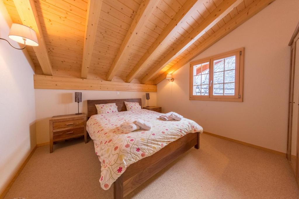 Postel nebo postele na pokoji v ubytování Chalet Nid Blanc