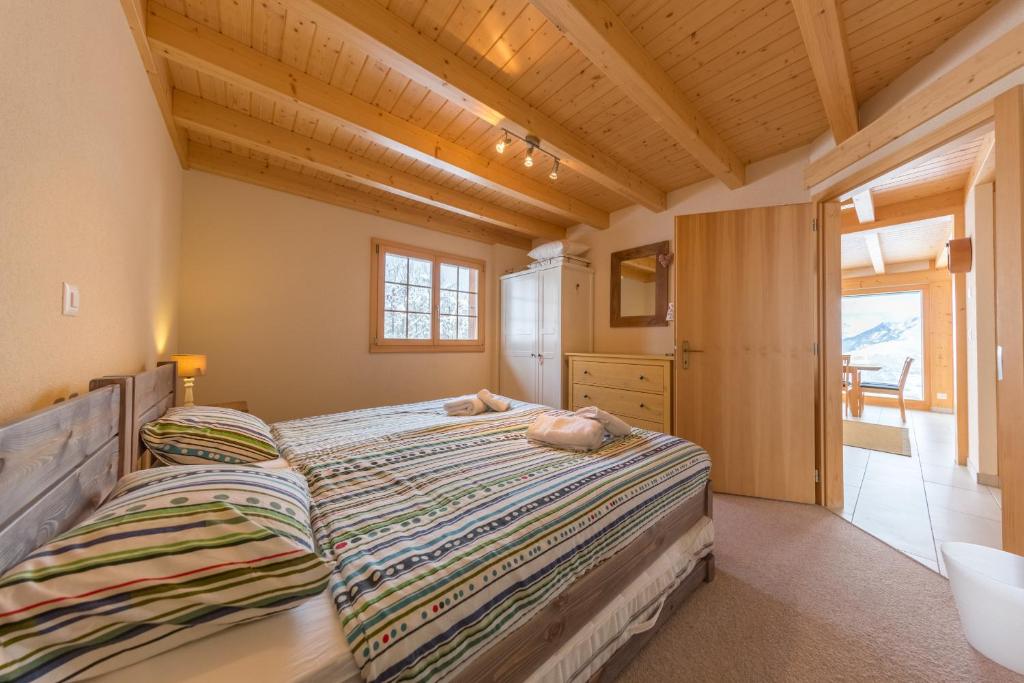 Postel nebo postele na pokoji v ubytování Chalet Nid Blanc