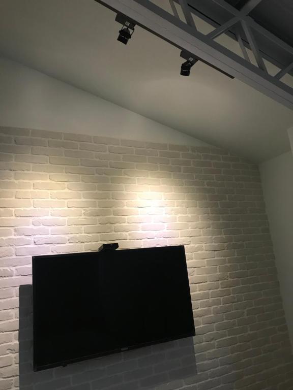 TV a/nebo společenská místnost v ubytování Donghai Cottage Backpack Inn Suite