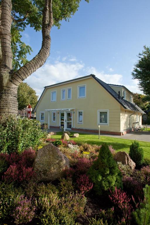 a house with a garden in front of it at meinHotel in Hamburg