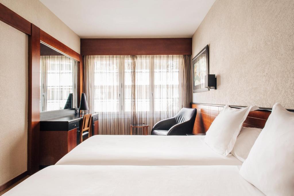 Posteľ alebo postele v izbe v ubytovaní Hotel Derby