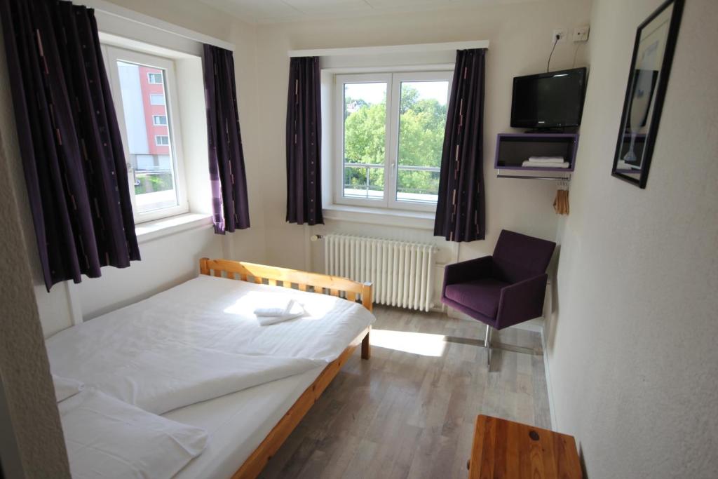 Postel nebo postele na pokoji v ubytování Hotel Abaca