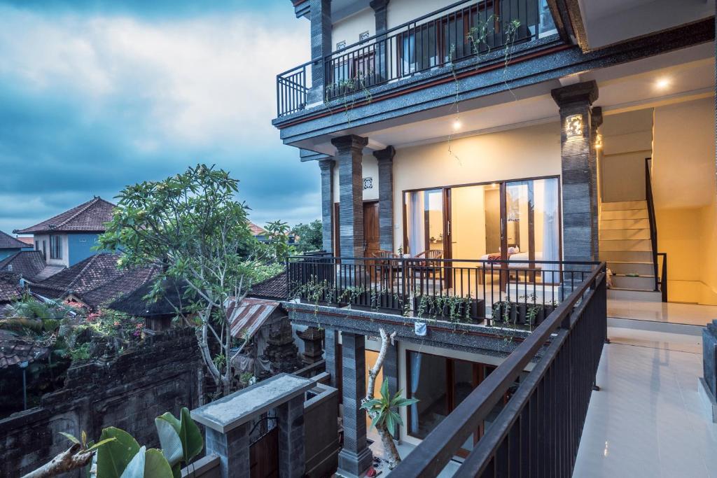an image of a house with a balcony at Darba Guest House Ubud in Ubud