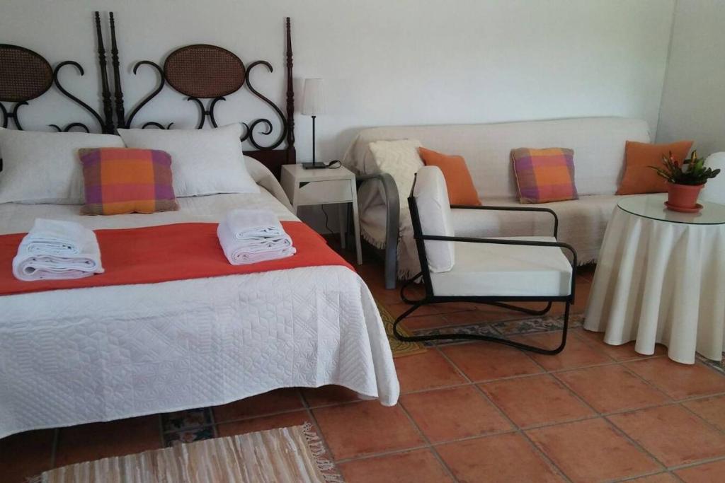 Posteľ alebo postele v izbe v ubytovaní Bungalow Cuesta de la Rosa. Casita rural con encanto y vistas