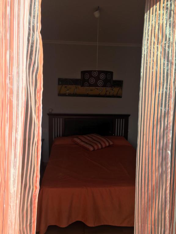 A bed or beds in a room at Residencial Cabodeiro