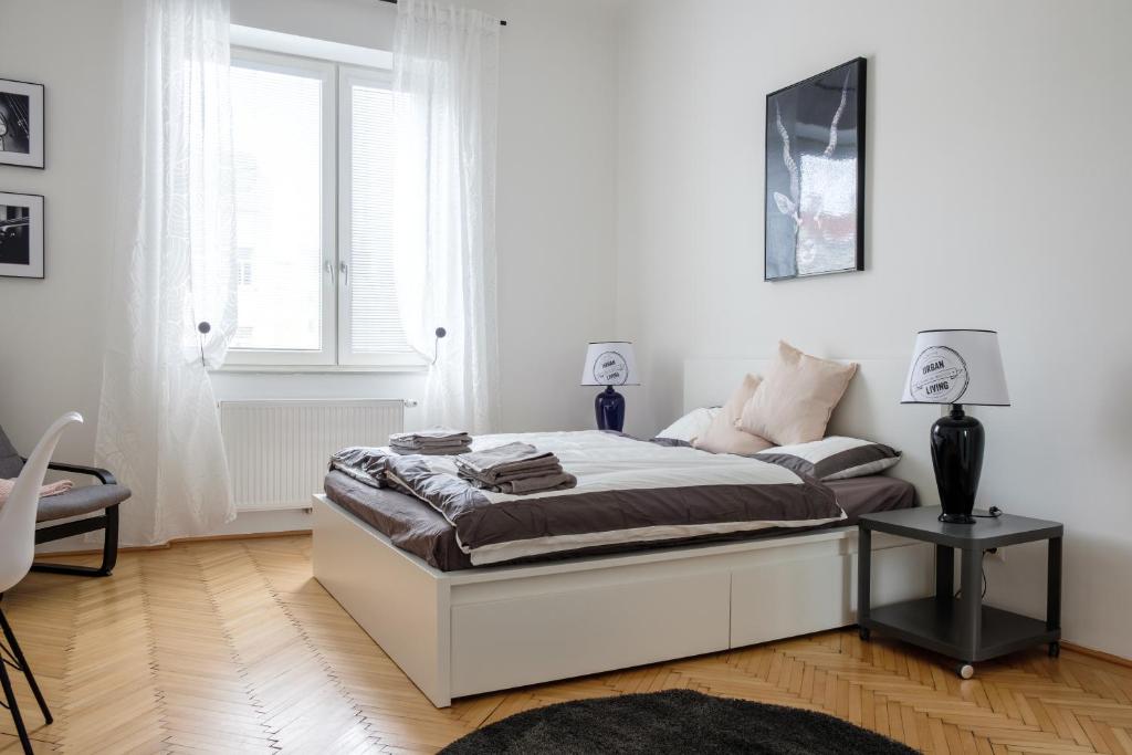 Uma cama ou camas num quarto em Vienna Experience