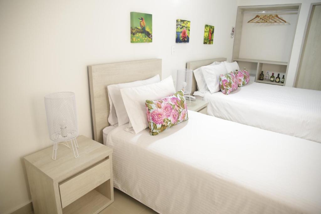 Postel nebo postele na pokoji v ubytování HOTEL HABANA REAL