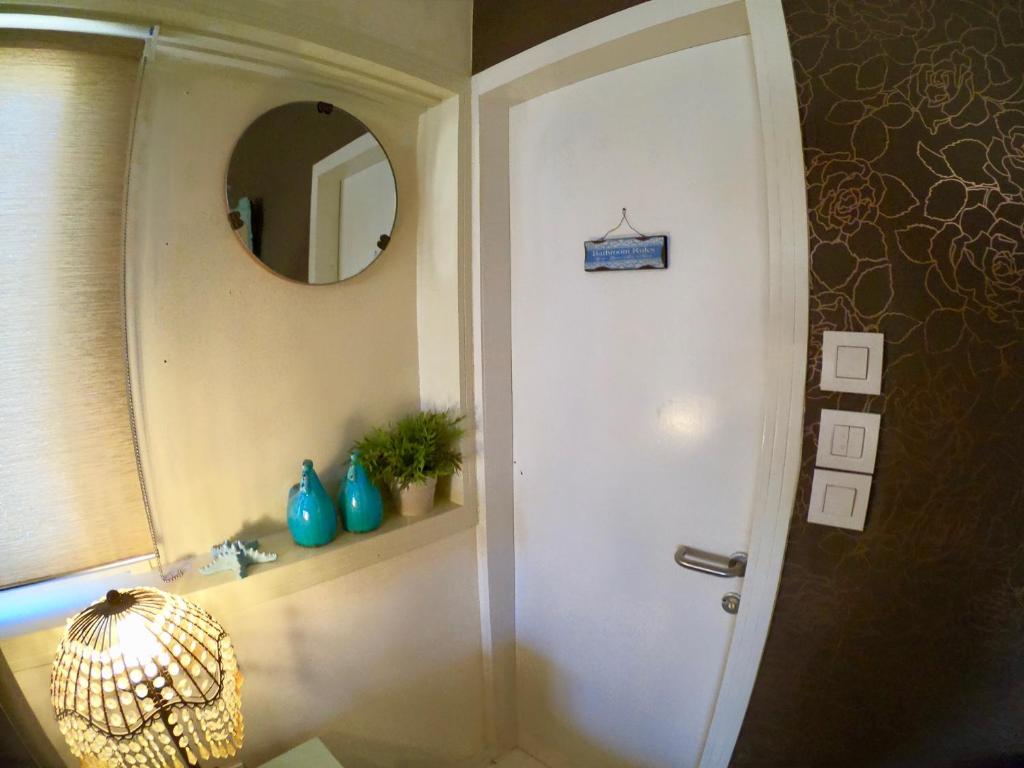 a bathroom with a shower and a mirror at Sweet Home, Only 7 Min to the beach - By SEAELO EILAT in Eilat