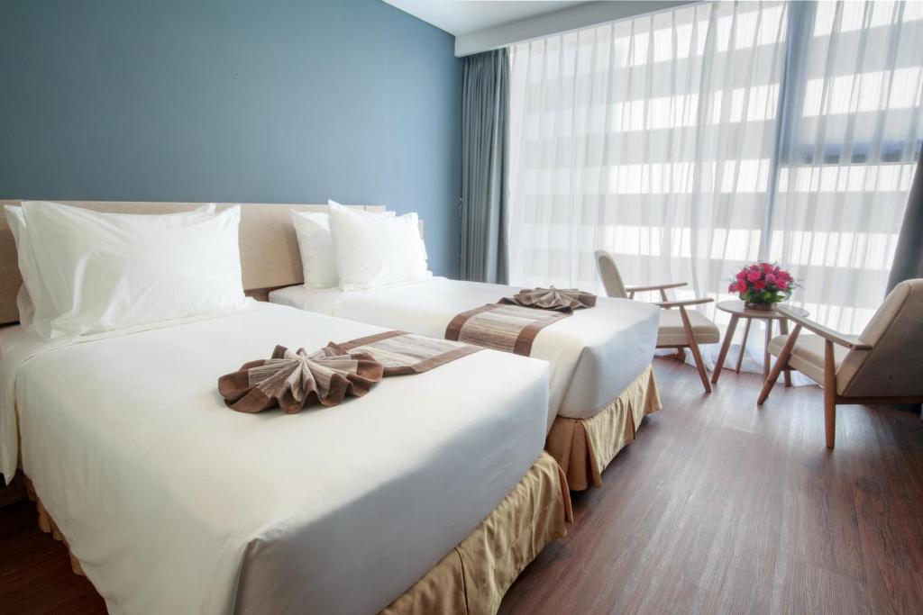 Phòng Deluxe Đôi hoặc 2 giường đơn nhìn ra 1 góc biển