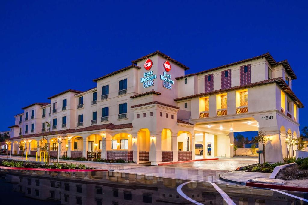 a hotel building with lights on in the night at Best Western Plus Temecula Wine Country Hotel & Suites in Temecula