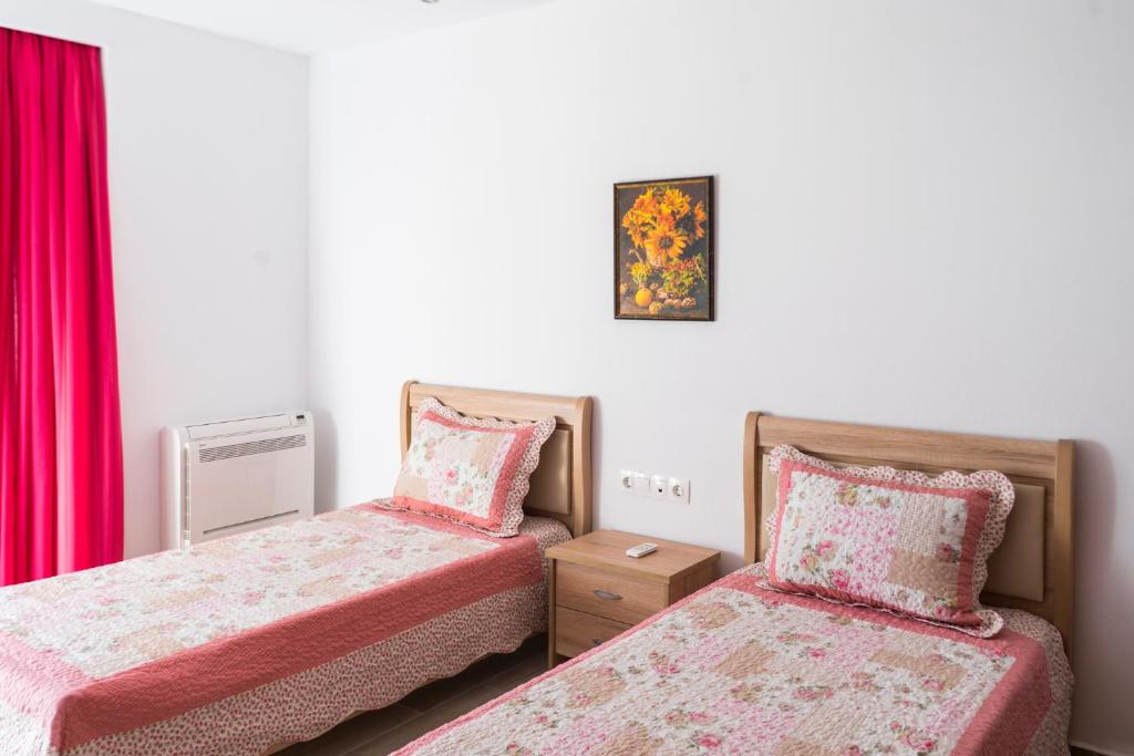 A bed or beds in a room at Estrella Villas