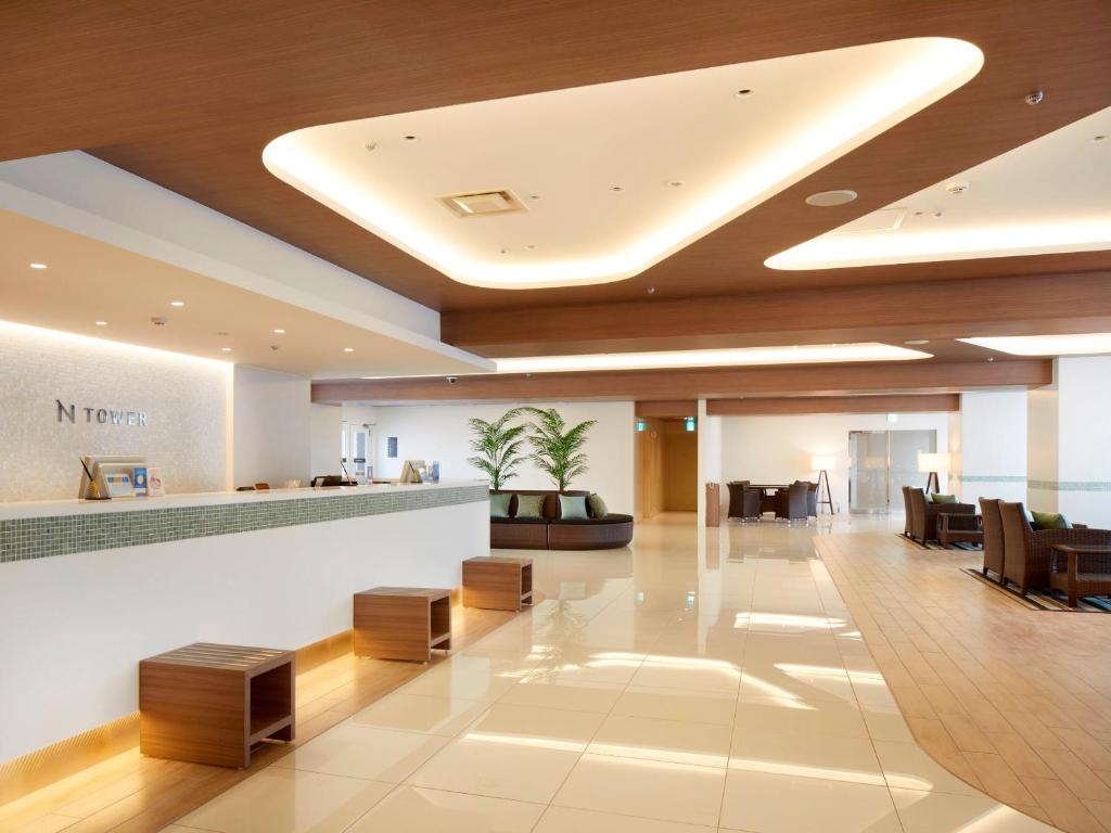 a lobby of a hospital with chairs and a reception desk at Shinagawa Prince Hotel N Tower in Tokyo