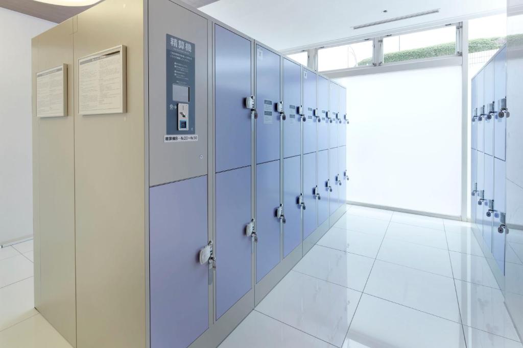 a row of lockers in a large room at Shinagawa Prince Hotel N Tower in Tokyo