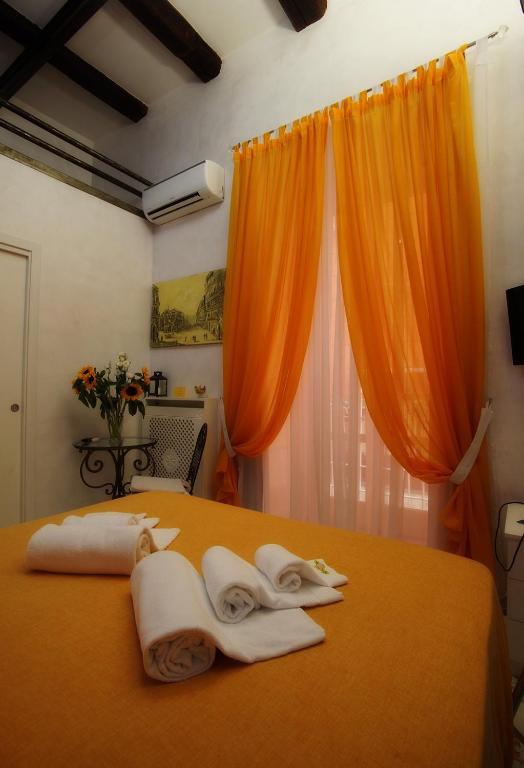 A bed or beds in a room at Le Vie Di Napoli B&B