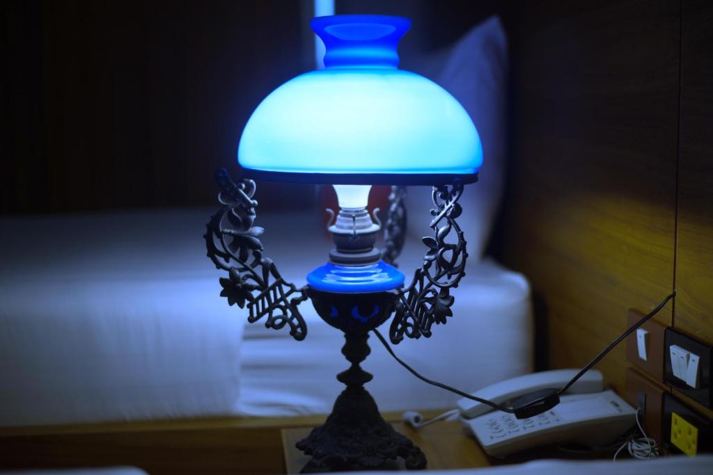 Postel nebo postele na pokoji v ubytování Jingjit Hotel