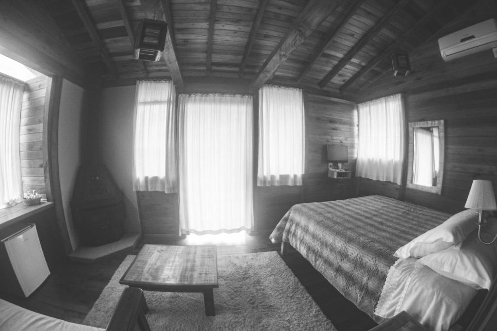 Postel nebo postele na pokoji v ubytování Café e Cabanas Lenha no Fogo