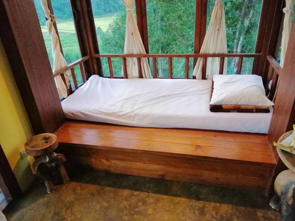 Postel nebo postele na pokoji v ubytování Khunyuam Resort