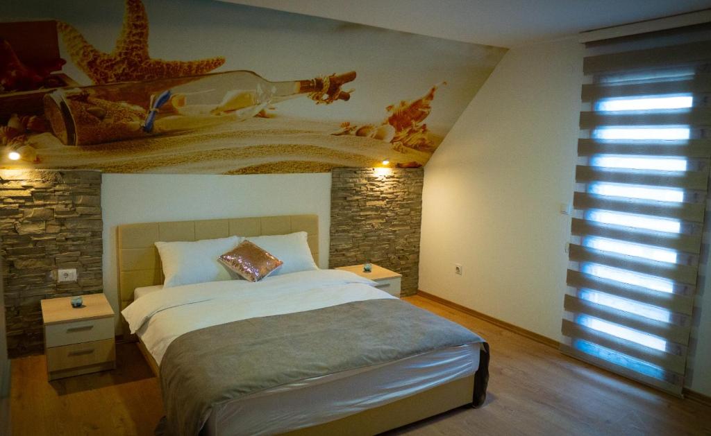 Postel nebo postele na pokoji v ubytování Vila Magnolija