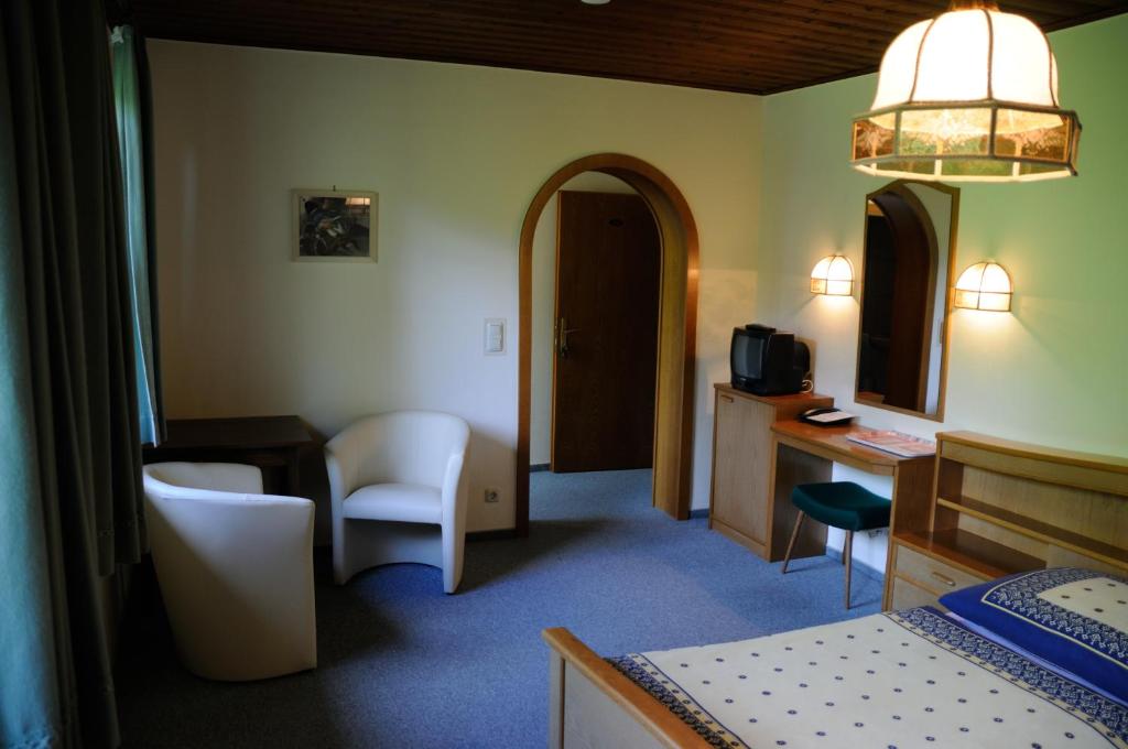 Postel nebo postele na pokoji v ubytování Strandhotel