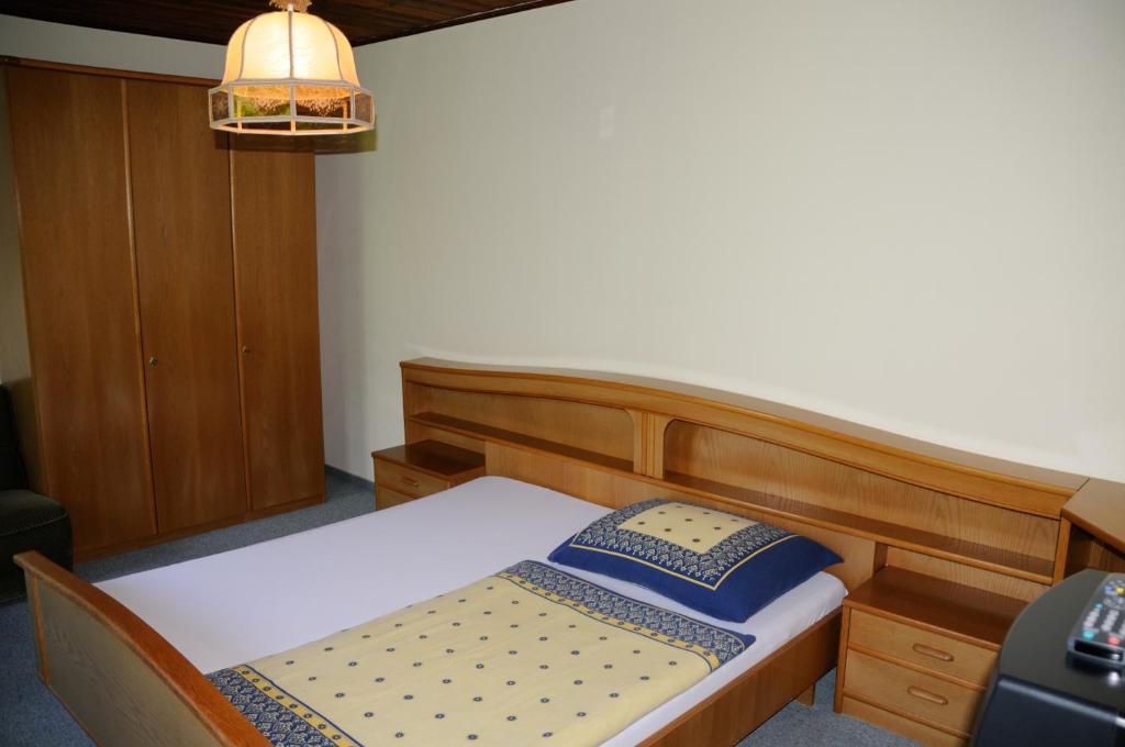 Postel nebo postele na pokoji v ubytování Strandhotel