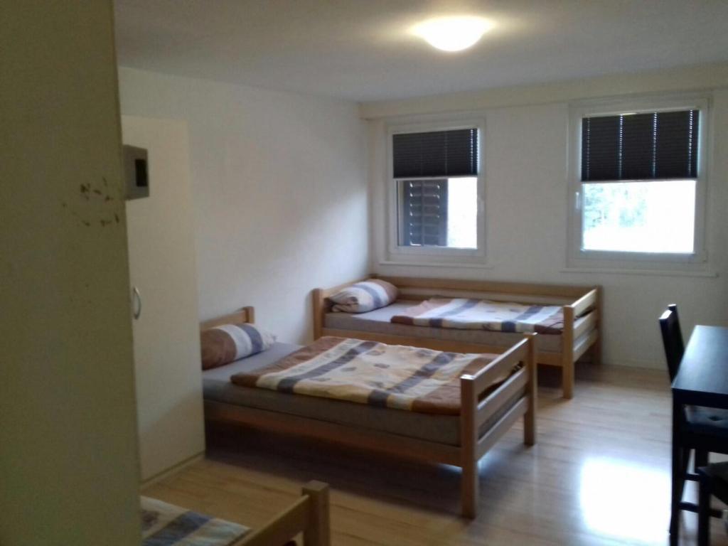 Postel nebo postele na pokoji v ubytování Hostel Airport
