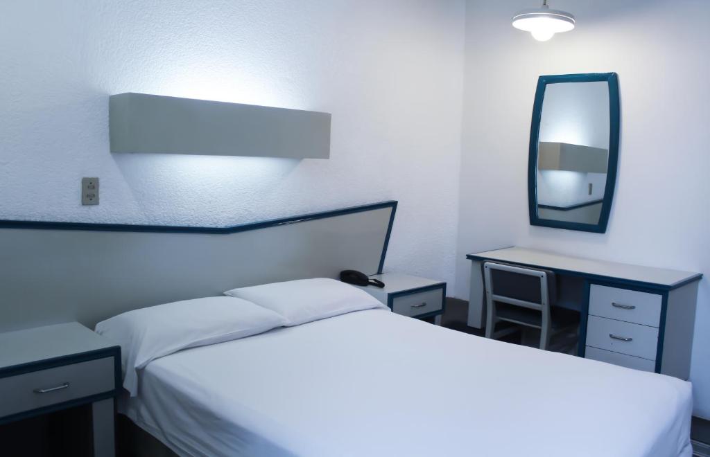 Postel nebo postele na pokoji v ubytování HOTEL OLIDEN