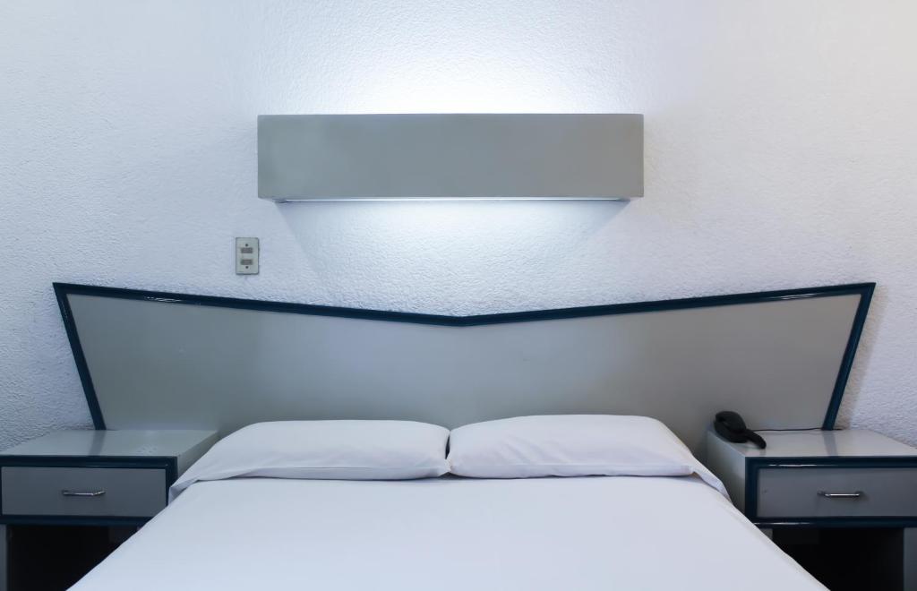 Postel nebo postele na pokoji v ubytování HOTEL OLIDEN