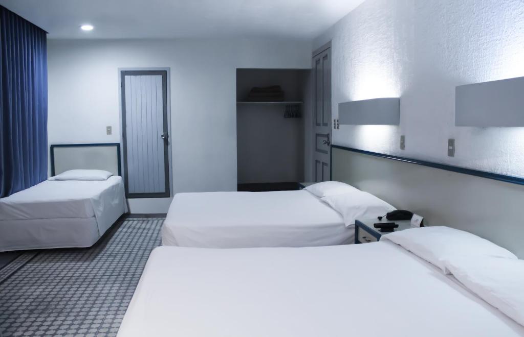 Postel nebo postele na pokoji v ubytování HOTEL OLIDEN
