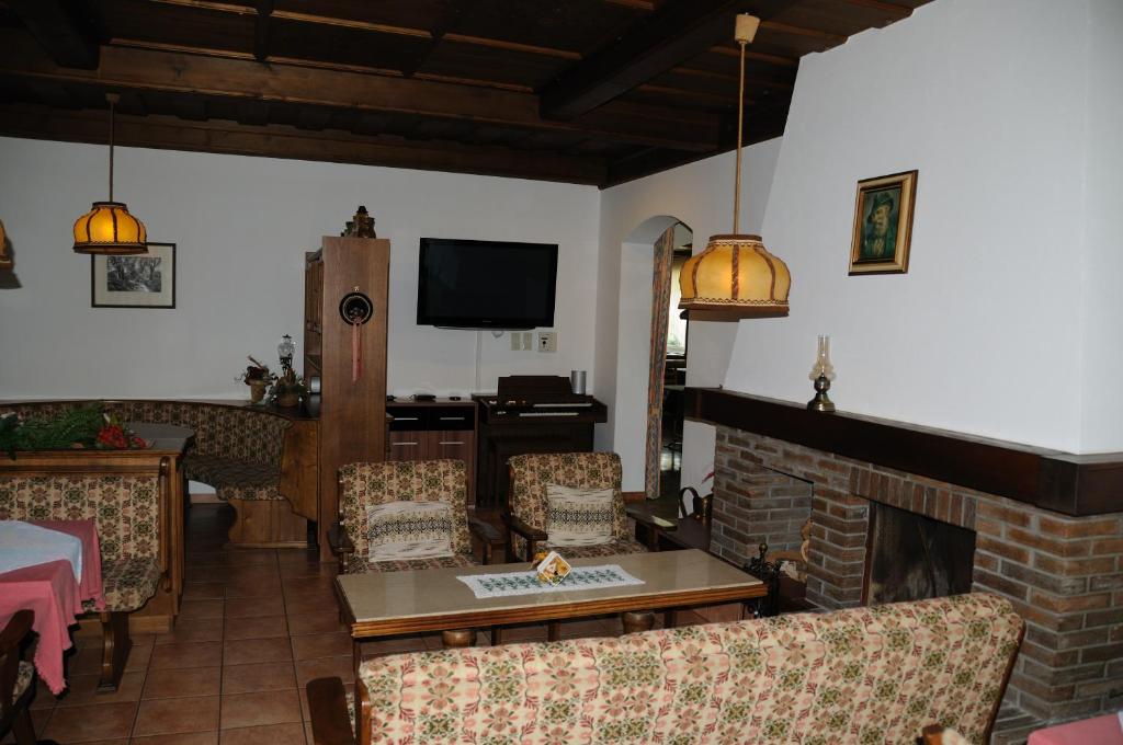 TV a/nebo společenská místnost v ubytování Strandhotel