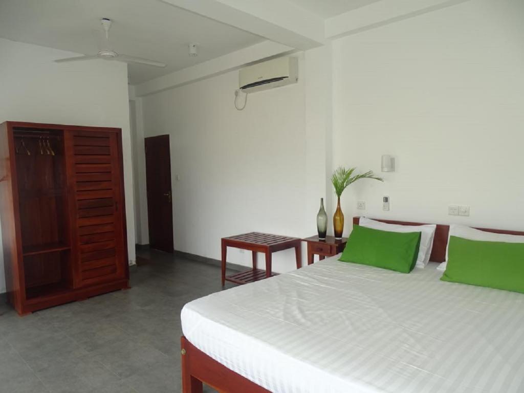 Postel nebo postele na pokoji v ubytování Jasmine Garden Beach Guest House