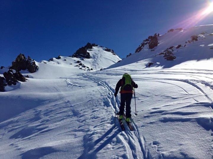 a person is skiing down a snow covered mountain at 9598 SS301 Trepalle APPARTAMENTO MIKI in Livigno