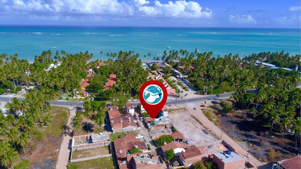 an overhead view of a town with a sign at Pousada Sereias de Maragogi in Ponta do Mangue